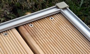 aluPatio with decking of Siberian Larch, corner closeup. aluPatio with decking of Siberian Larch, corner closeup.